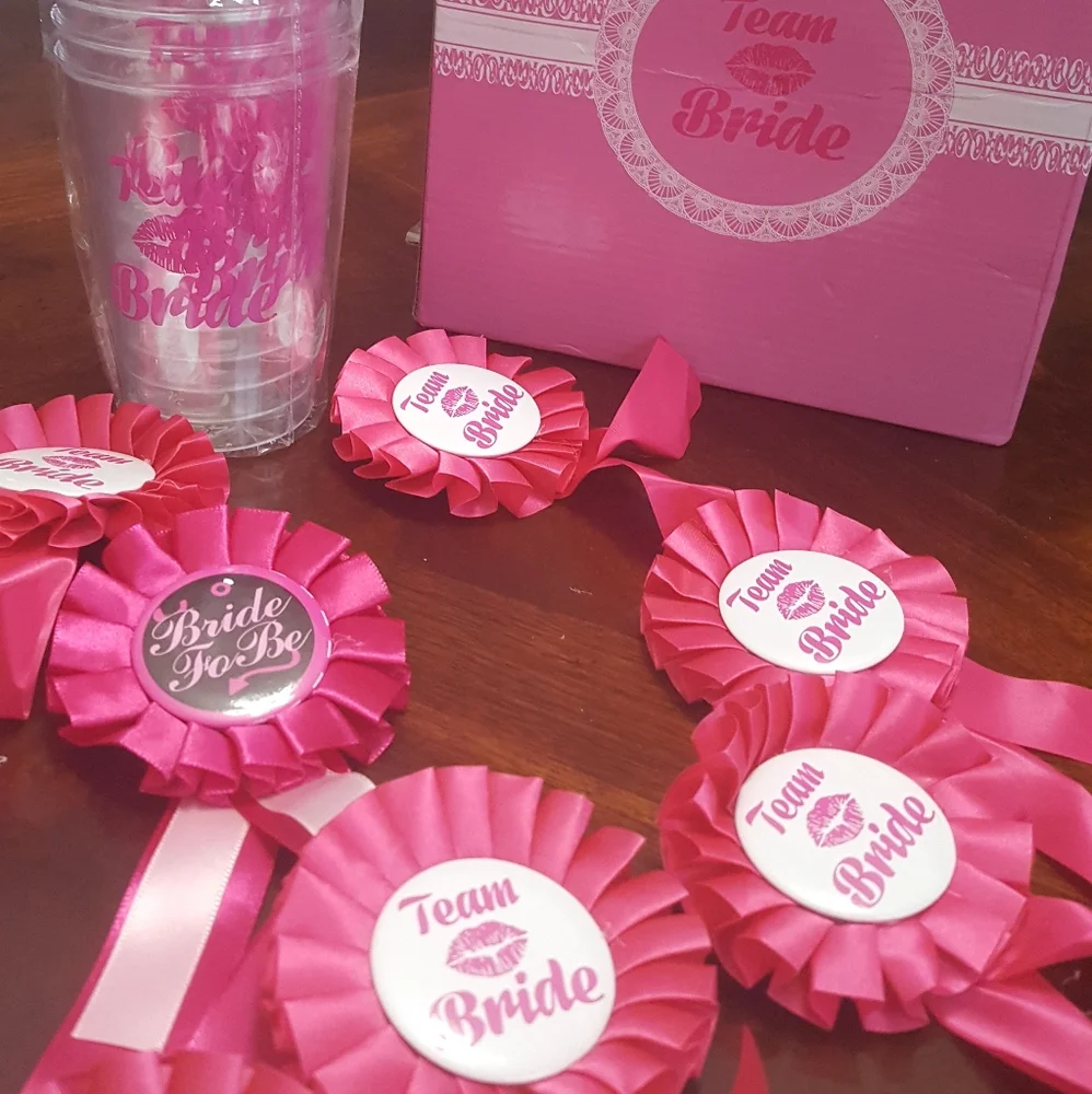 Team bride. Cups and lapel pins.